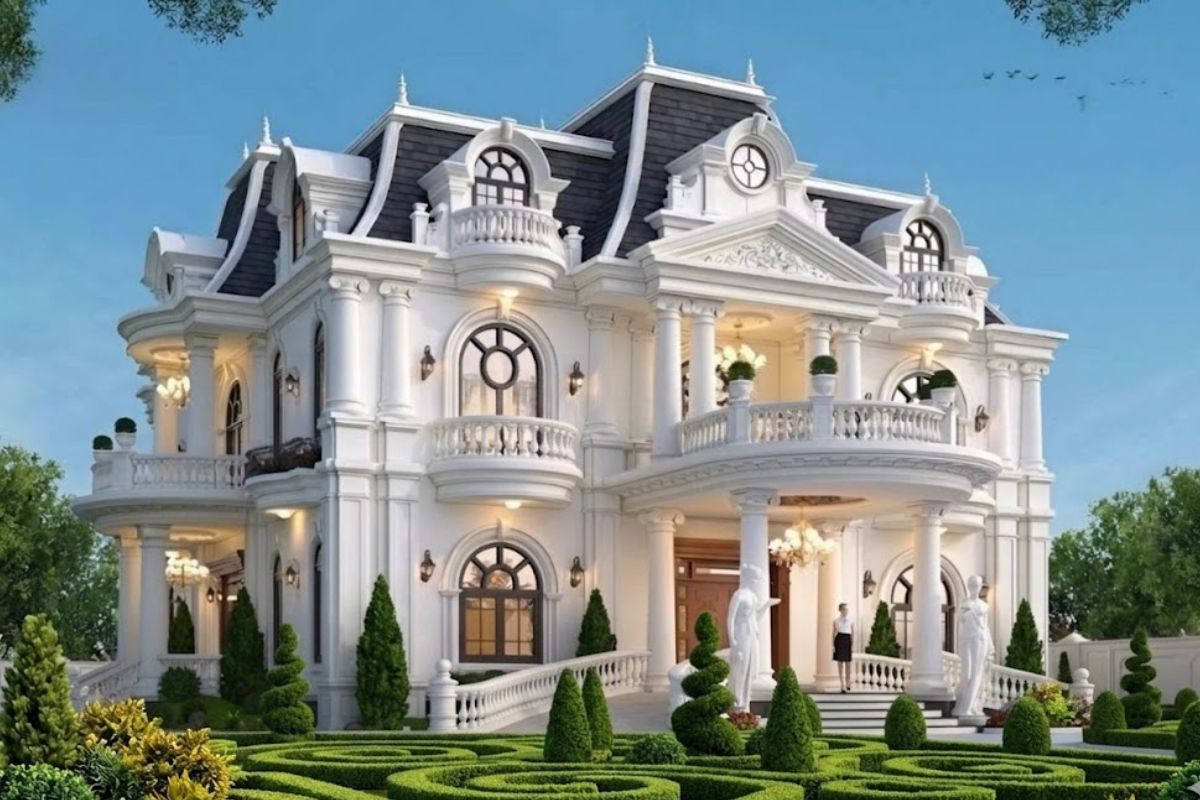 10+ Mẫu biệt thự cổ điển mái Mansard đẹp & bản vẽ công năng 2026 16 Biệt thự cổ điển mái Mansard kết hợp sân vườn xanh mát tạo nên không gian sống hài hòa giữa kiến trúc và thiên nhiên