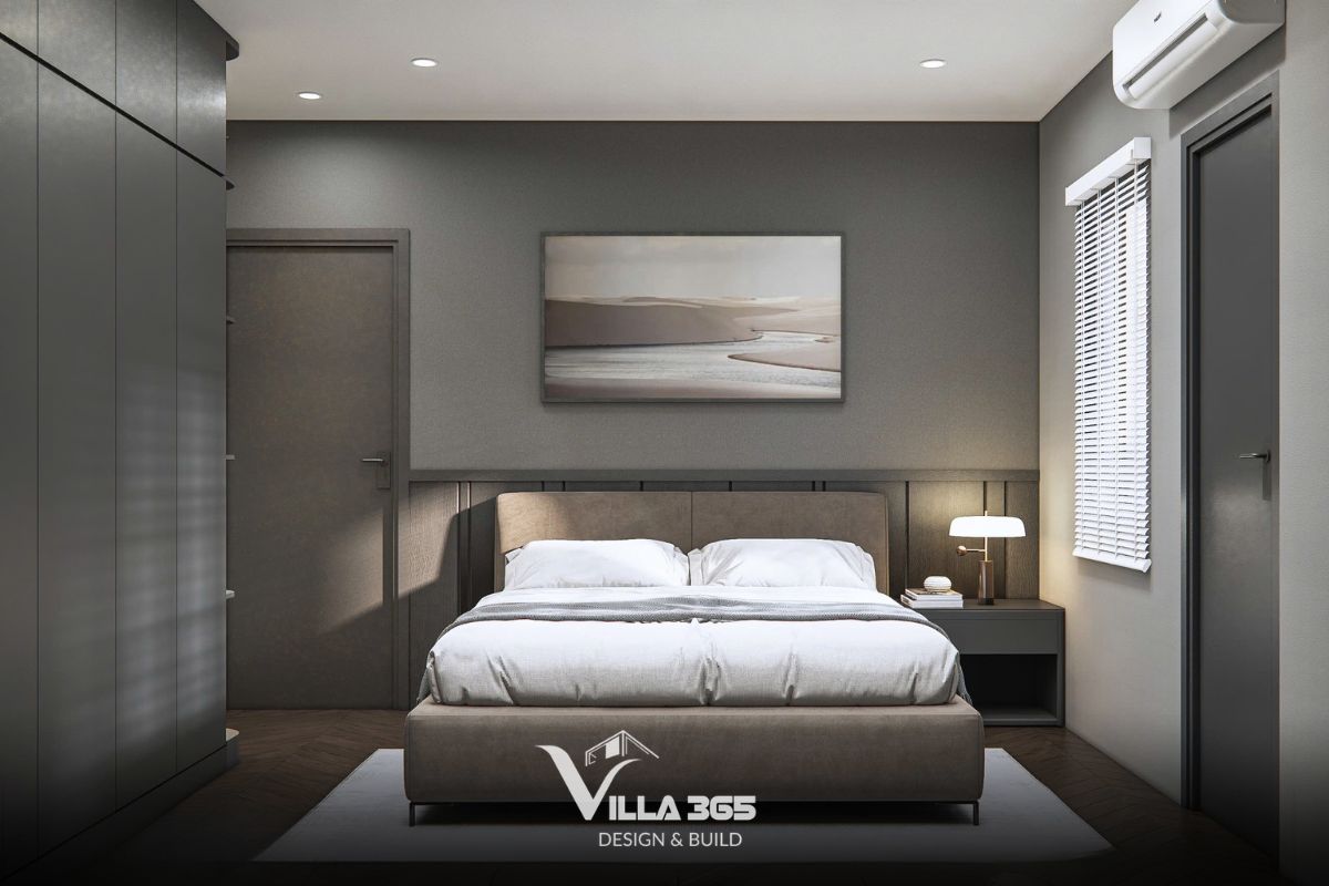 Thiết kế nội thất Dual Villa – Giải pháp tổ chức không gian kép cho gia chủ làm việc tại nhà 16 Tông màu beige và nâu ấm của giường ngủ và tranh decor làm dịu đi sắc thái lạnh lẽo của diện tường màu xám ghi